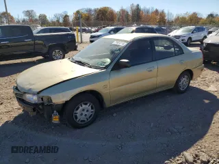 1997 Mitsubishi Mirage z VIN JA3AY36A9VU027615, wystawiony jako Copart lot #77401214 z przebiegiem 104 407 mil mil oraz Szkoda całkowita • Salvage title. Historia ofert i sprzedaży dostępna na DreamBid. Obrazek 1.