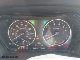 2015 BMW 2 Series 228i with VIN WBA1K5C57FV473826, listed as a IAAI auction lot 41866820 with 130,823 mi miles. Bid and sale history available at carsss.com. Image 7.