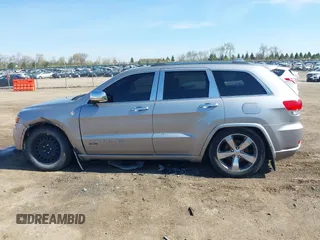 2014 Jeep Grand Cherokee Overland with VIN 1C4RJFCT9EC231840, listed as a IAAI auction lot 42114284 with 170,691 mi miles and . Bid and sale history available at DreamBid. Image 14.