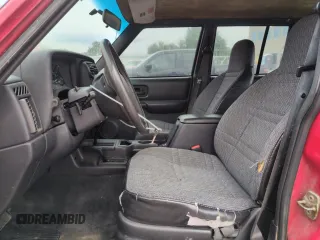 1999 Jeep Cherokee Sport with VIN 1J4FF68S2XL648735, listed as a Copart auction lot 58758115 with 252,248 mi miles and Salvage title. Bid and sale history available at DreamBid. Image 7.