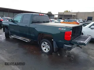 2014 Chevrolet Silverado 1500 LT with VIN 1GCVKREC7EZ312679, listed as a IAAI auction lot 40874395 with 153,234 mi miles and . Bid and sale history available at DreamBid. Image 3.