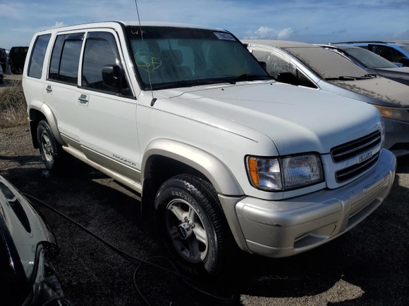 2000 Isuzu Trooper S z VIN JACDS58XXY7J11716, wystawiony jako Copart lot #76685304 z przebiegiem 92 828 mil mil oraz Nie do naprawy. Historia ofert i sprzedaży dostępna na DreamBid. Obrazek 4.