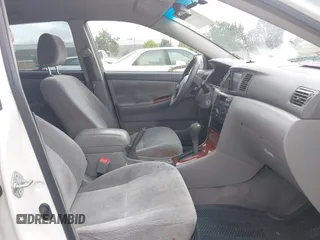 2004 Toyota Corolla CE with VIN JTDBR32E440052035, listed as a IAAI auction lot 42218301 with 299,999 mi miles. Bid and sale history available at carsss.com. Image 5.