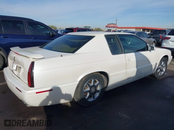 2001 Cadillac Eldorado Touring ETC z VIN 1G6ET12991B104624, wystawiony jako IAAI lot #41616324 z przebiegiem Nie podano mil oraz . Historia ofert i sprzedaży dostępna na DreamBid. Obrazek 4.