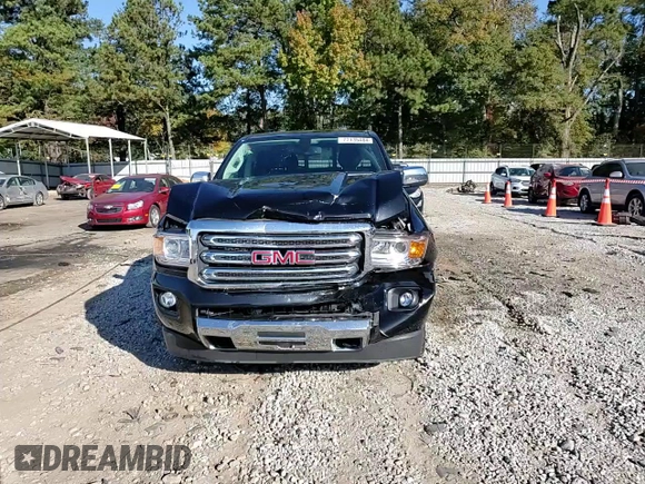 2018 GMC Canyon 4WD SLT with VIN 1GTG6DEN4J1296628, listed as a Copart auction lot 77135484 with 74,486 mi miles and Salvage Title. Bid and sale history available at carsss.com. Image 14.