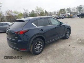 2017 Mazda CX-5 Touring with VIN JM3KFBCL9H0163449, listed as a IAAI auction lot 41919020 with 102,898 mi miles. Bid and sale history available at carsss.com. Image 4.