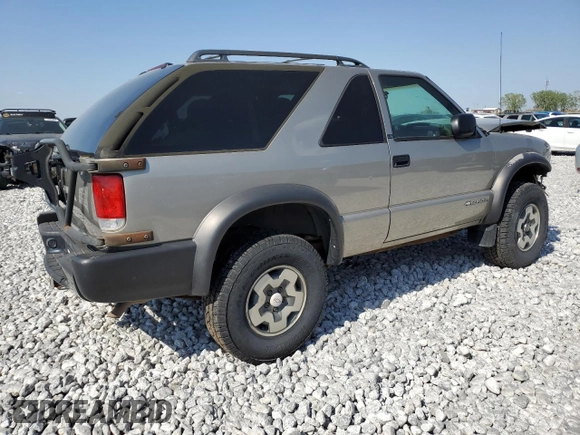 2001 Chevrolet Blazer LS z VIN 1GNCT18W71K130129, wystawiony jako Copart lot #85113764 z przebiegiem 65 992 mil mil oraz Czysty tytuł • Clean title. Historia ofert i sprzedaży dostępna na DreamBid. Obrazek 3.