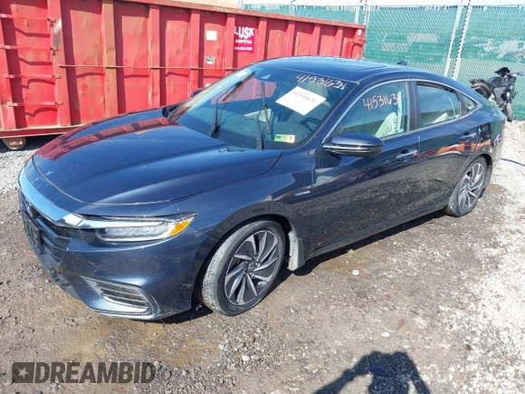 2020 Honda Insight Touring with VIN 19XZE4F90LE005829, listed as a IAAI auction lot 41531631 with 29,758 mi miles and . Bid and sale history available at carsss.com. Image 2.