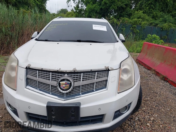 2010 Cadillac SRX Premium Collection z VIN 3GYFNCEY4AS569787, wystawiony jako IAAI lot #42524167 z przebiegiem 222 000 mil mil oraz . Historia ofert i sprzedaży dostępna na DreamBid. Obrazek 6.