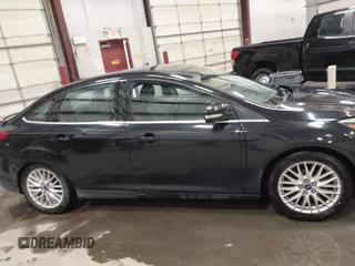 2014 Ford Focus Titanium with VIN 1FADP3J22EL199563, listed as a IAAI auction lot 41450106 with 129,271 mi miles. Bid and sale history available at carsss.com. Image 13.