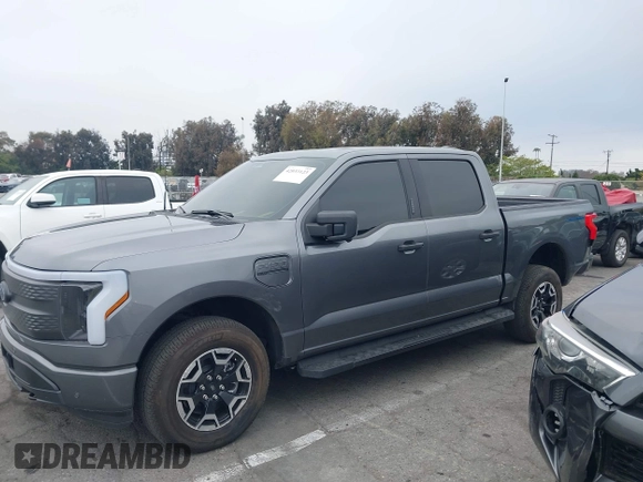2023 Ford F-150 Lightning Pro with VIN 1FTVW1EL8PWG48559, listed as a IAAI auction lot 42033123 with 8,845 mi miles and . Bid and sale history available at DreamBid. Image 14.
