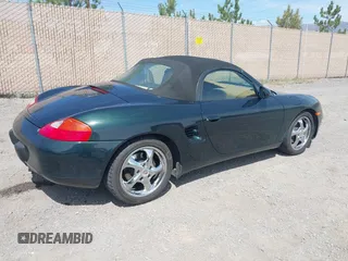 1999 Porsche Boxster with VIN WP0CA2986XU627495, listed as a IAAI auction lot 42112724 with 94,090 mi miles and . Bid and sale history available at DreamBid. Image 4.
