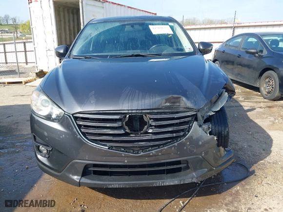 2016 Mazda CX-5 Touring with VIN JM3KE4CY3G0672977, listed as a IAAI auction lot 41889137 with 130,593 mi miles. Bid and sale history available at carsss.com. Image 13.