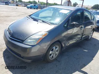 2007 Toyota Prius z VIN JTDKB20UX73217307, wystawiony jako IAAI lot #42225740 z przebiegiem 196 251 mil mil oraz . Historia ofert i sprzedaży dostępna na DreamBid. Obrazek 2.