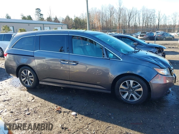 2014 Honda Odyssey Touring with VIN 5FNRL5H94EB081267, listed as a IAAI auction lot 41199509 with 146,827 mi miles and . Bid and sale history available at DreamBid. Image 13.