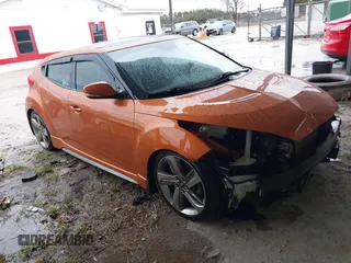 2014 Hyundai Veloster Turbo with VIN KMHTC6AE9EU185825, listed as a IAAI auction lot 41371770 with 113,325 mi miles and . Bid and sale history available at DreamBid. Image 1.