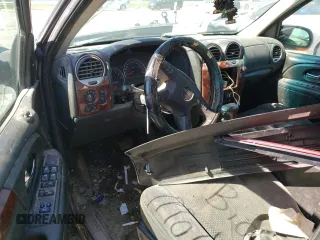 2005 GMC Envoy SLT z VIN 1GKET16M356134877, wystawiony jako Copart lot #57333345 z przebiegiem 205 714 mil mil oraz Szkoda całkowita • Salvage title. Historia ofert i sprzedaży dostępna na DreamBid. Obrazek 8.