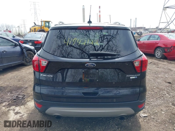 2019 Ford Escape Titanium with VIN 1FMCU9J91KUC42161, listed as a IAAI auction lot 41942122 with 100,677 mi miles and . Bid and sale history available at DreamBid. Image 16.