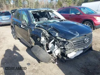 2016 Mazda CX-5 Grand Touring with VIN JM3KE4DY4G0909782, listed as a IAAI auction lot 41006111 with 30,135 mi miles. Bid and sale history available at carsss.com. Image 6.