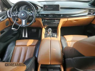 2016 BMW X6 xDrive35i z VIN 5UXKU2C51G0N80206, wystawiony jako Copart lot #58943895 z przebiegiem 74 870 mil mil oraz Szkoda całkowita • Salvage title. Historia ofert i sprzedaży dostępna na DreamBid. Obrazek 8.