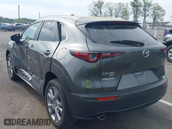 2024 Mazda CX-30 S Carbon Edition with VIN 3MVDMBCM5RM665341, listed as a IAAI auction lot 42180459 with 4,496 mi miles and . Bid and sale history available at DreamBid. Image 3.
