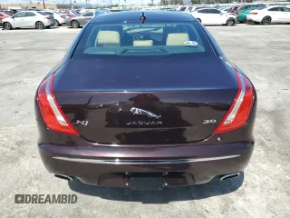 2014 Jaguar XJ with VIN SAJWA1CZ3E8V69877, listed as a Copart auction lot 51520405 with 57,567 mi miles and Clean Title. Bid and sale history available at DreamBid. Image 6.