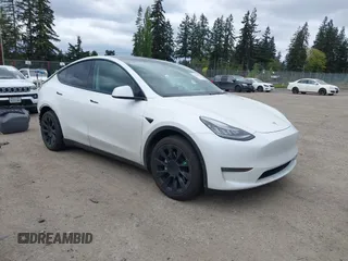 2021 Tesla Model Y Long Range with VIN 5YJYGDEE6MF082883, listed as a IAAI auction lot 42078807 with 64,953 mi miles. Bid and sale history available at carsss.com. Image 1.