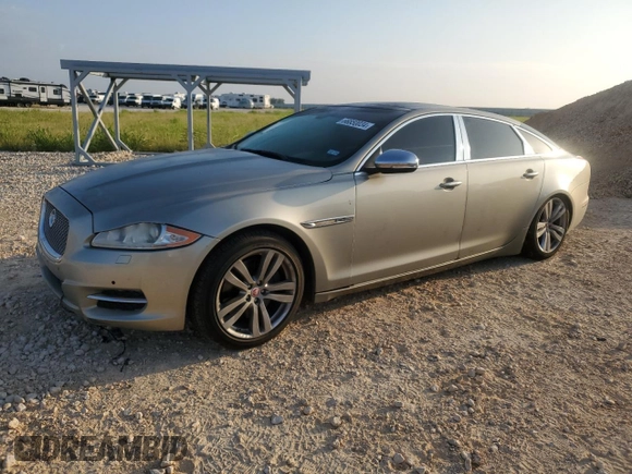 2014 Jaguar XJ Portfolio with VIN SAJWJ2GD7E8V61558, listed as a Copart auction lot 66850034 with 130,984 mi miles and Salvage title. Bid and sale history available at DreamBid. Image 1.