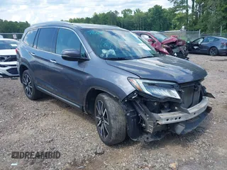 2020 Honda Pilot Touring 7-Passenger z VIN 5FNYF6H6XLB033008, wystawiony jako IAAI lot #42447326 z przebiegiem 74 872 mil mil oraz . Historia ofert i sprzedaży dostępna na DreamBid. Obrazek 1.