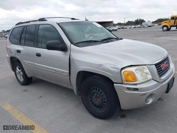 2004 GMC Envoy SLE with VIN 1GKDS13S642247715, listed as a IAAI auction lot 41472984 with 240,550 mi miles. Bid and sale history available at carsss.com. Image 1.