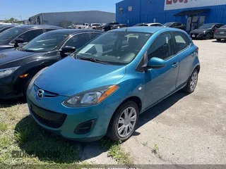 2011 Mazda 2 Sport with VIN JM1DE1HY7B0116561, listed as a IAAI auction lot 42006952 with 139,369 mi miles. Bid and sale history available at carsss.com. Image 2.