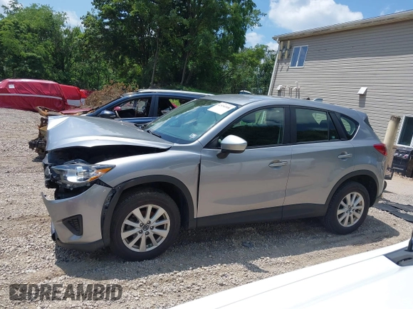 2014 Mazda CX-5 Sport with VIN JM3KE2BEXE0329303, listed as a IAAI auction lot 42556908 with 127,836 mi miles and . Bid and sale history available at DreamBid. Image 14.