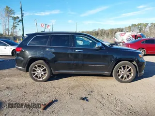 2014 Jeep Grand Cherokee Summit with VIN 1C4RJEJG1EC130727, listed as a IAAI auction lot 41269066 with 205,914 mi miles and . Bid and sale history available at DreamBid. Image 13.