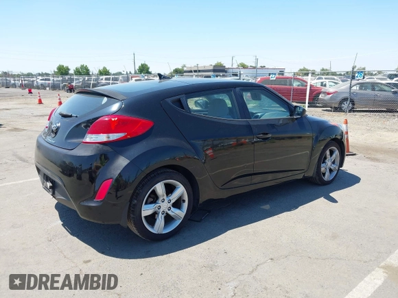 2013 Hyundai Veloster w/Black Int with VIN KMHTC6AD2DU144376, listed as a IAAI auction lot 42720882 with 143,023 mi miles and . Bid and sale history available at DreamBid. Image 4.