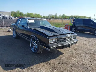 1984 Chevrolet Monte Carlo z VIN 1G1AZ37H9ER201513, wystawiony jako IAAI lot #42246033 z przebiegiem 80 467 mil mil oraz . Historia ofert i sprzedaży dostępna na DreamBid. Obrazek 1.