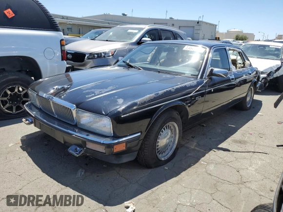 1990 Jaguar XJ with VIN SAJKY1745LC622713, listed as a Copart auction lot 56545414 with Not Provided miles and Salvage Title. Bid and sale history available at DreamBid. Image 1.