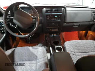 2000 Jeep Cherokee z VIN 1J4FF48S9YL260200, wystawiony jako Copart lot #52471365 z przebiegiem 89 435 mil mil oraz Szkody całkowita. Historia ofert i sprzedaży dostępna na DreamBid. Obrazek 8.