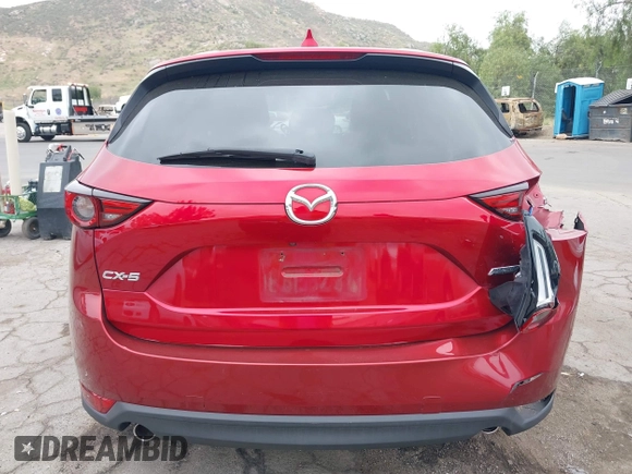 2018 Mazda CX-5 Grand Touring with VIN JM3KFADMXJ0302656, listed as a IAAI auction lot 42099173 with 125,378 mi miles and . Bid and sale history available at DreamBid. Image 16.