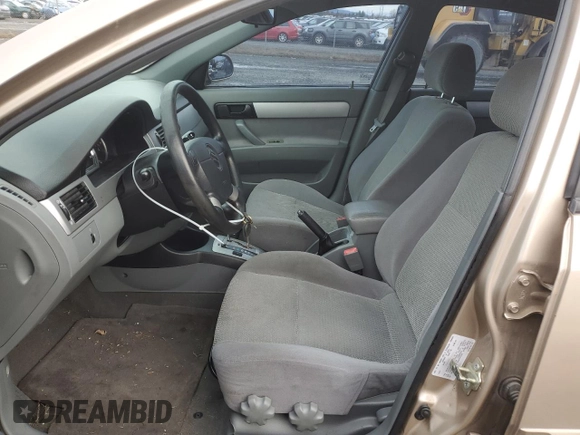 2007 Suzuki Forenza z VIN KL5JD56Z07K657218, wystawiony jako Copart lot #86767854 z przebiegiem 93 044 mil mil oraz Szkoda całkowita • Salvage title. Historia ofert i sprzedaży dostępna na DreamBid. Obrazek 7.