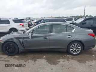 2015 Infiniti Q50 Premium z VIN JN1BV7AR9FM413801, wystawiony jako IAAI lot #42134770 z przebiegiem 111 367 mil mil oraz . Historia ofert i sprzedaży dostępna na DreamBid. Obrazek 14.