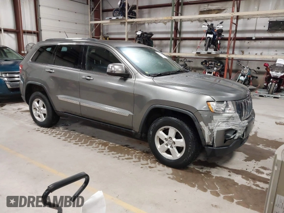 2011 Jeep Grand Cherokee Laredo with VIN 1J4RR4GG3BC623048, listed as a IAAI auction lot 42163452 with 192,241 mi miles and . Bid and sale history available at DreamBid. Image 1.