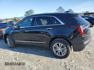 2023 Cadillac XT5 FWD Premium Luxury with VIN 1GYKNCR48PZ132957, listed as a Copart auction lot 42132845 with 27,312 mi miles and Salvage Title. Bid and sale history available at carsss.com. Image 2.