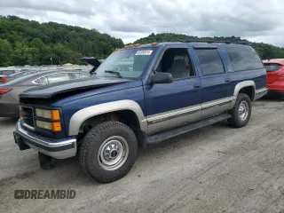 1999 GMC Suburban z VIN 1GKGK26J6XJ771768, wystawiony jako Copart lot #66300974 z przebiegiem 181 048 mil mil oraz Szkody całkowita. Historia ofert i sprzedaży dostępna na DreamBid. Obrazek 1.
