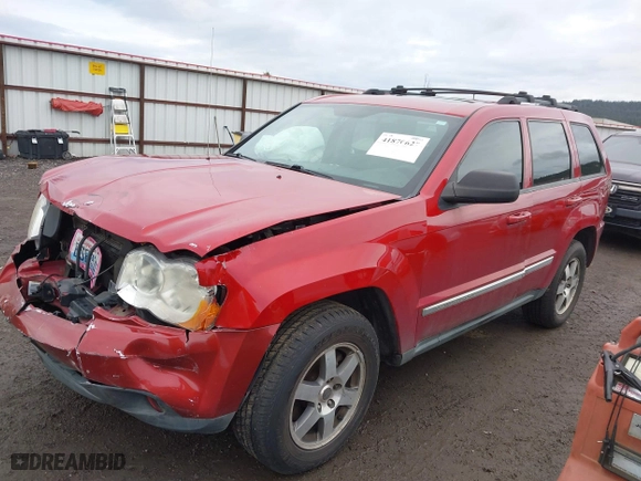 2009 Jeep Grand Cherokee Laredo with VIN 1J8GR48K99C549346, listed as a IAAI auction lot 41870627 with 170,949 mi miles. Bid and sale history available at carsss.com. Image 2.