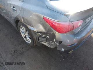 2015 Infiniti Q50 Premium z VIN JN1BV7AR2FM423666, wystawiony jako IAAI lot #41345228 z przebiegiem 67 027 mil mil oraz . Historia ofert i sprzedaży dostępna na DreamBid. Obrazek 6.