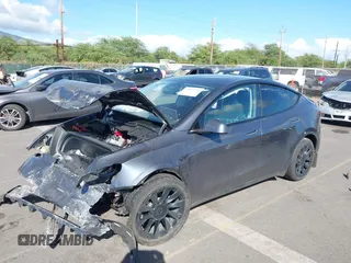 2023 Tesla Model Y Long Range z VIN 7SAYGAEE4PF945847, wystawiony jako IAAI lot #41071924 z przebiegiem 33 454 mil mil oraz . Historia ofert i sprzedaży dostępna na DreamBid. Obrazek 6.