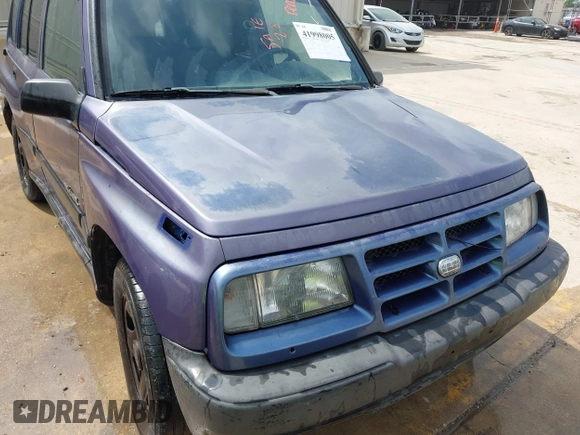 1996 Geo Tracker z VIN 2CNBE1361T6901708, wystawiony jako IAAI lot #41998005 z przebiegiem 223 266 mil mil oraz . Historia ofert i sprzedaży dostępna na DreamBid. Obrazek 6.