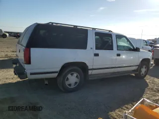 1998 GMC Suburban z VIN 1GKFK16R1WJ700312, wystawiony jako Copart lot #73160574 z przebiegiem 150 174 mil mil oraz Czysty tytuł • Clean title. Historia ofert i sprzedaży dostępna na DreamBid. Obrazek 3.
