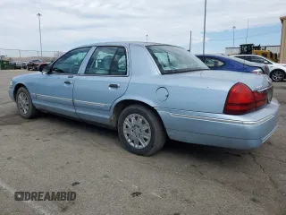 2005 Mercury Grand Marquis GS z VIN 2MEFM74W25X624329, wystawiony jako Copart lot #50945805 z przebiegiem 140 717 mil mil oraz Tytuł czysty. Historia ofert i sprzedaży dostępna na DreamBid. Obrazek 2.