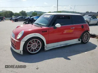 2004 MINI Hardtop with VIN WMWRC33444TC50103, listed as a Copart auction lot 63449615 with 144,467 mi miles and Salvage title. Bid and sale history available at DreamBid. Image 1.